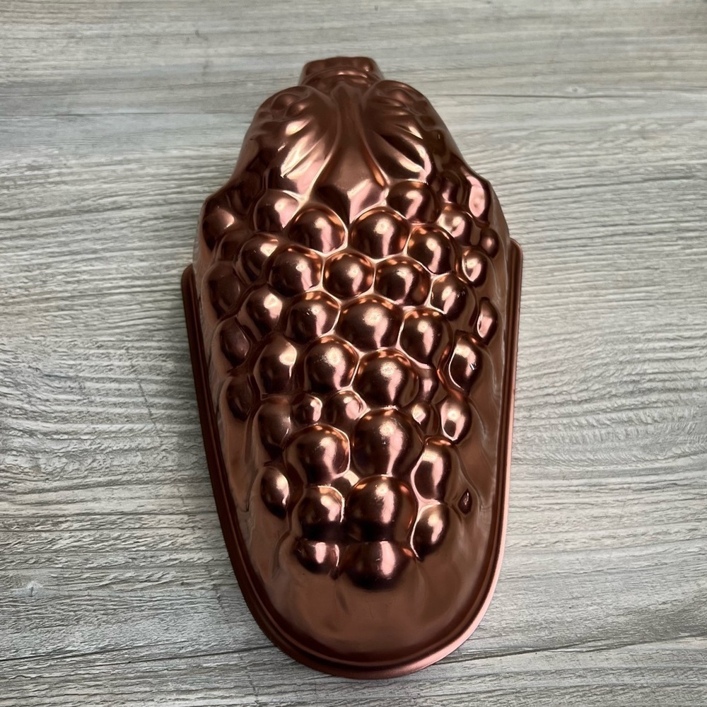 Vintage cooper aluminum bunch of grapes mold.